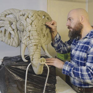 Matt Buckley sculpting an elephant bust
